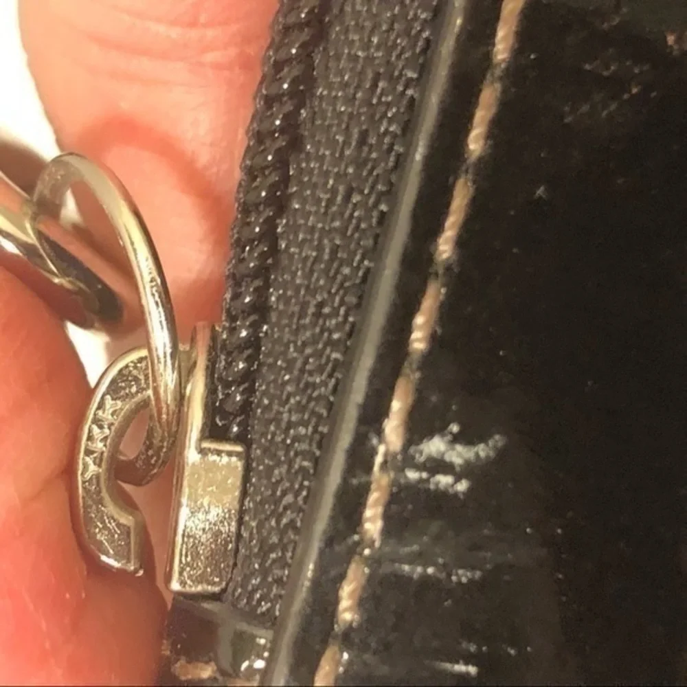 Coach embossed black leather wristlet clutch bag